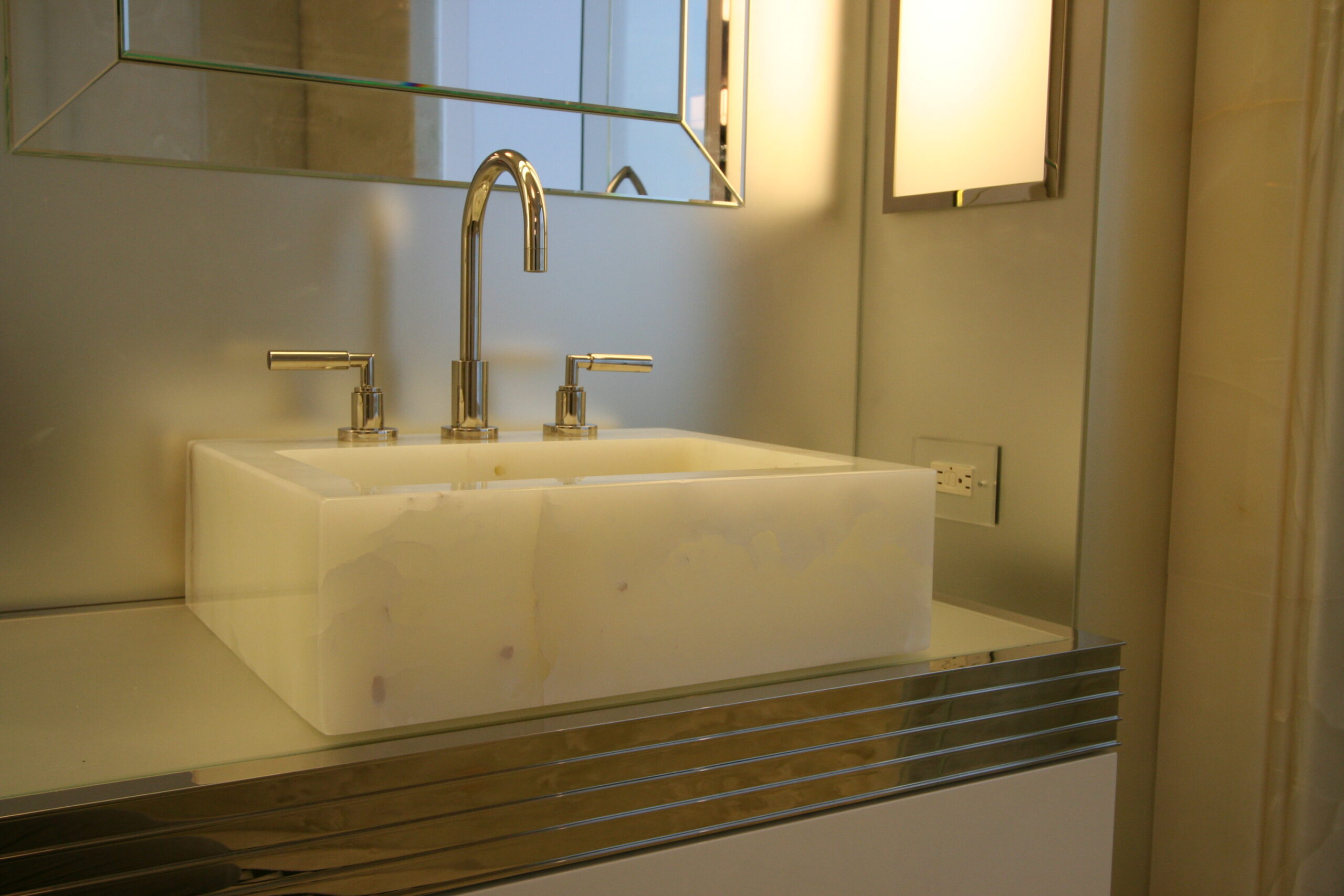 Master bathroom carved sink in white onyx
