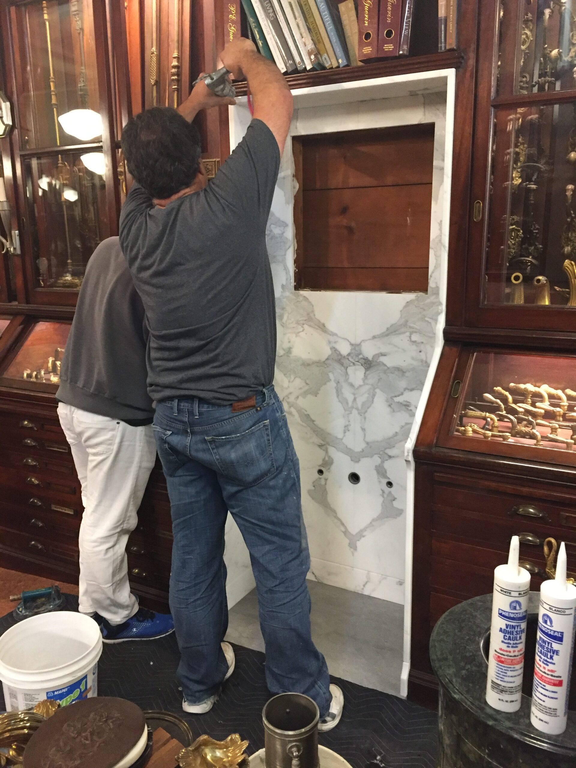 PE Guerin calacatta white marble sink niche installation
