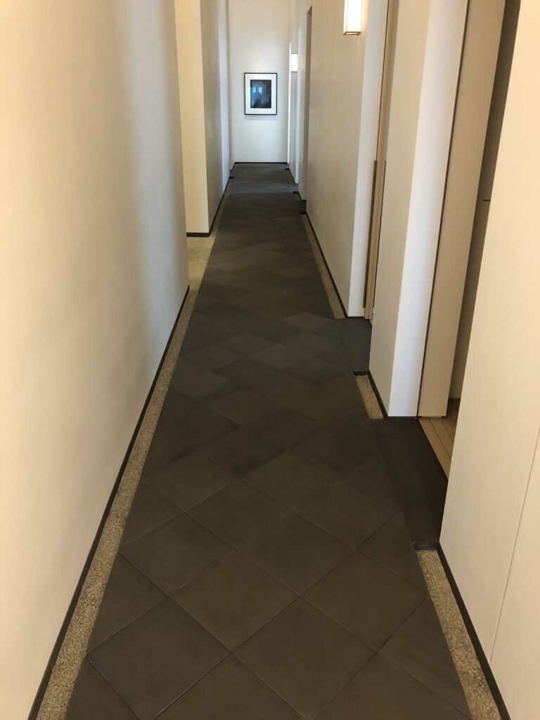 432 Park Ave hallway with pillowed tiles and Japanese pebble border