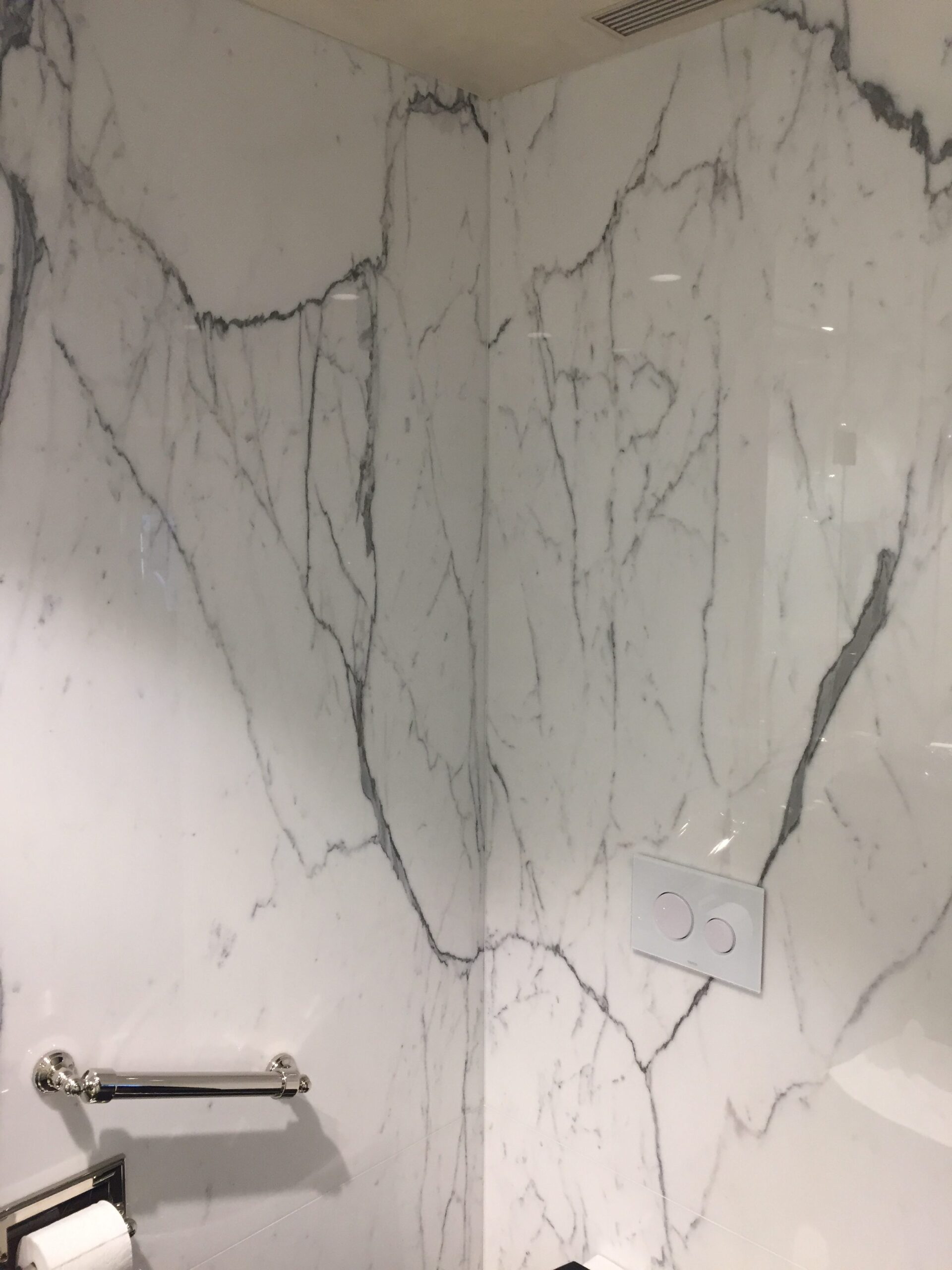 Master bathroom calacatta marble slab walls