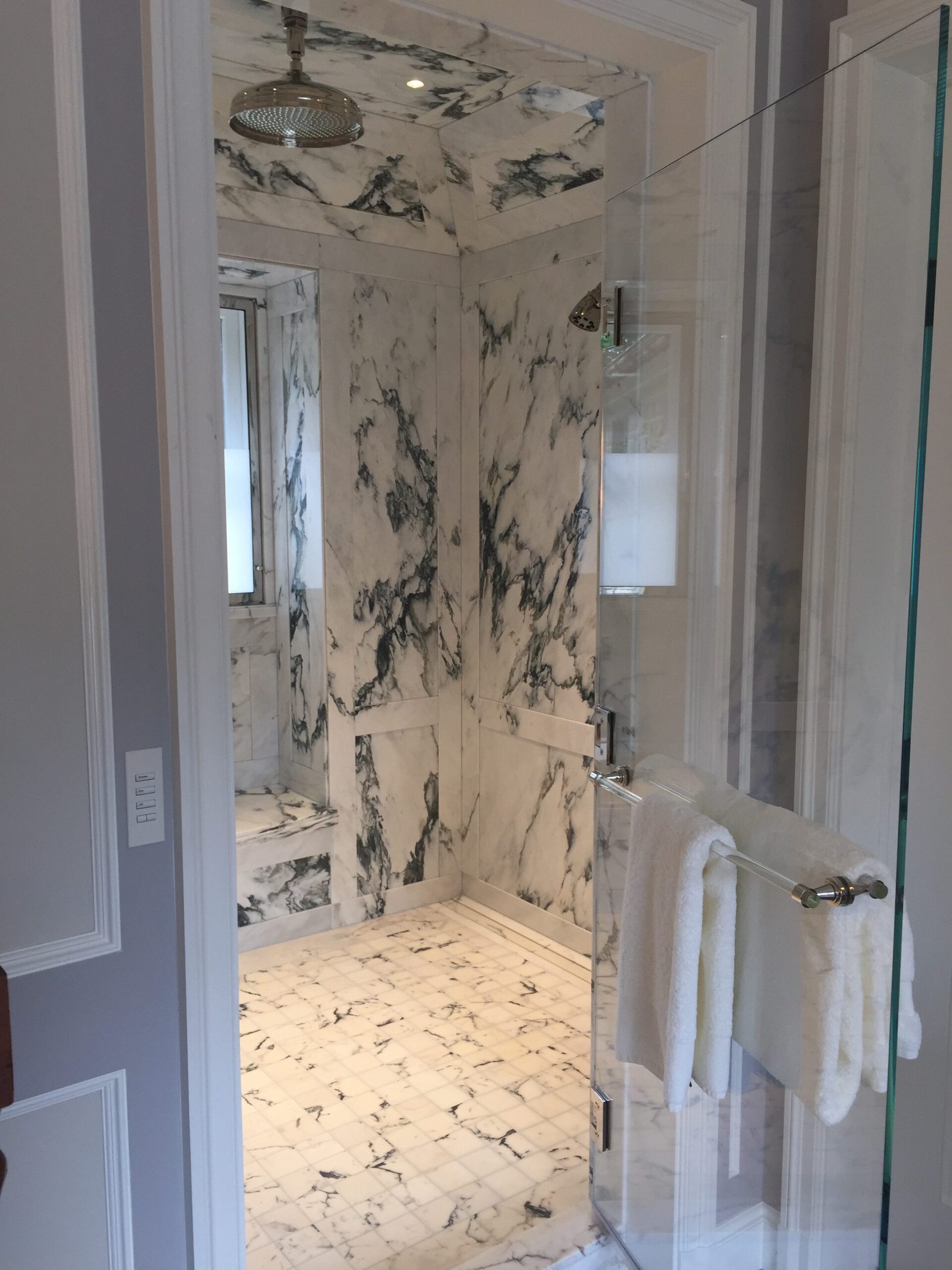 Master bathroom paneled shower window bench niche, floor, walls and ceiling in paonazzo white marble