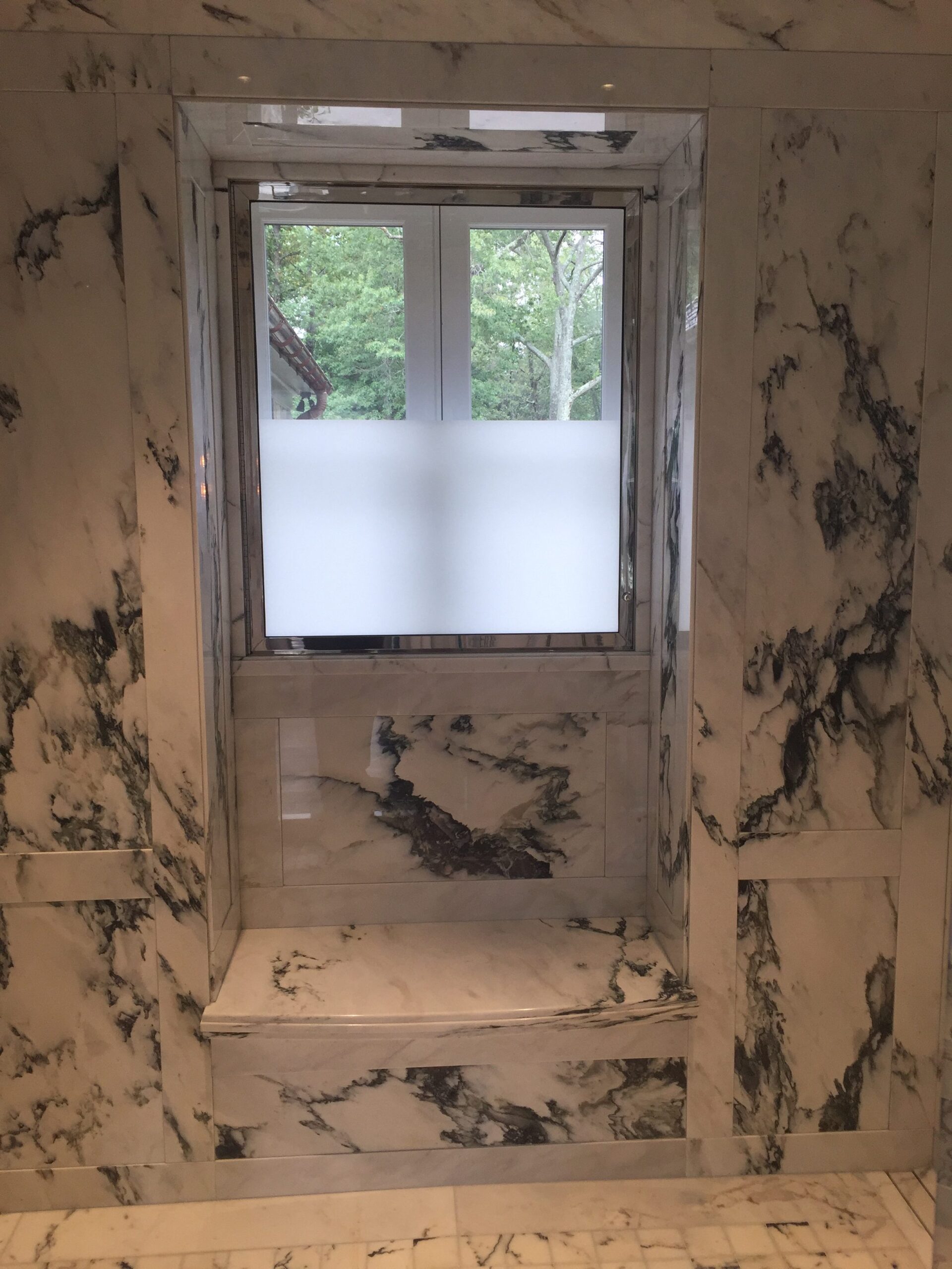 Paneled shower window bench niche in paonazzo white marble
