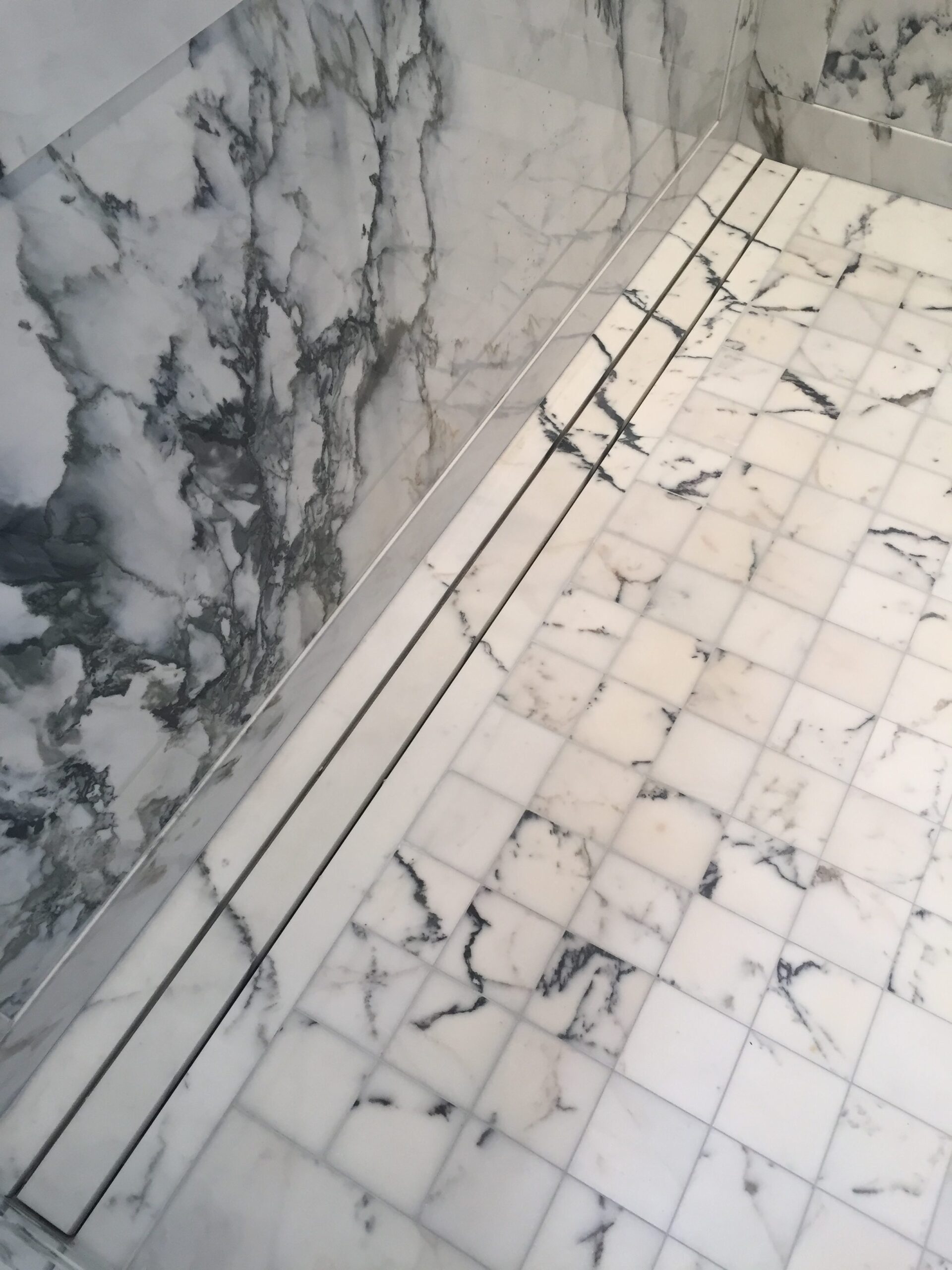 Shower floor linear drain in paonazzo marble