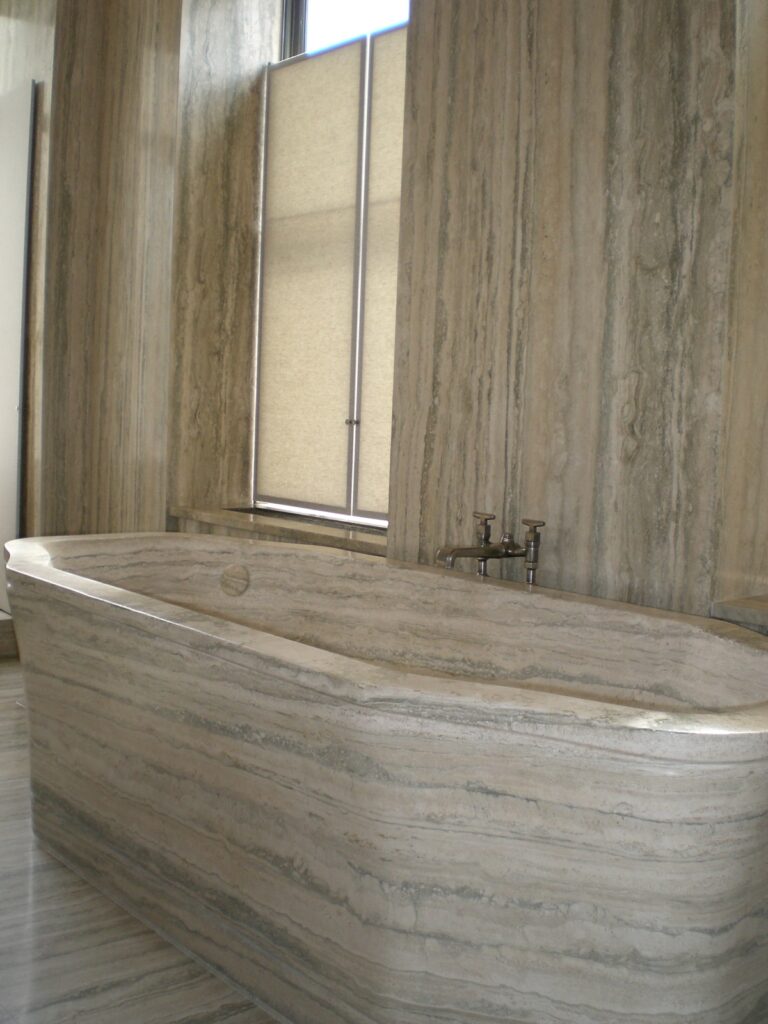 A Silver travertine custom designed bathtub carved in Italy for a residence on 5th Avenue in NYC