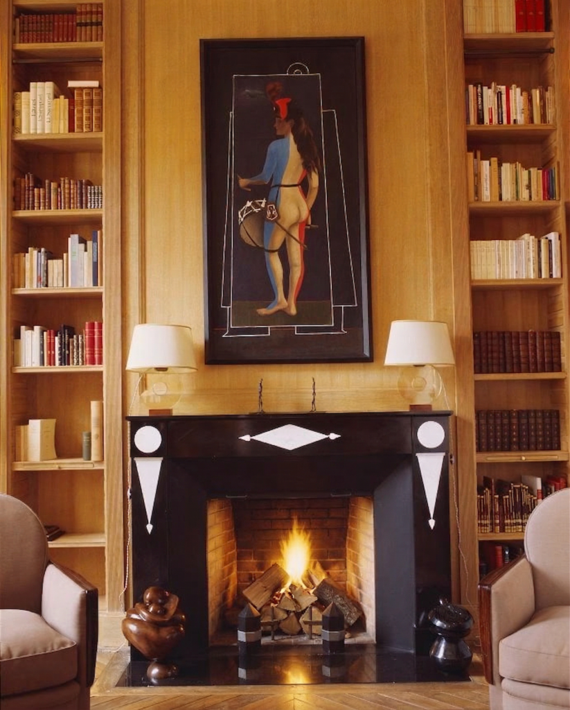 NYC townhouse library with custom designed belgium black and thassos marble fireplace
