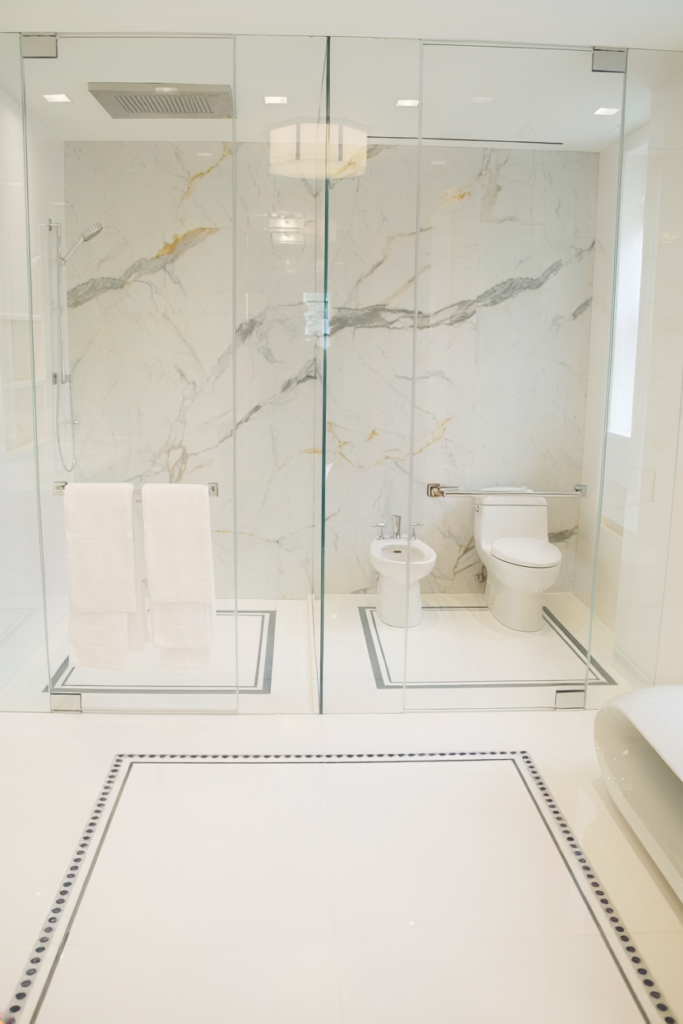 Super modern NYC primary bath in thassos and calacatta marble