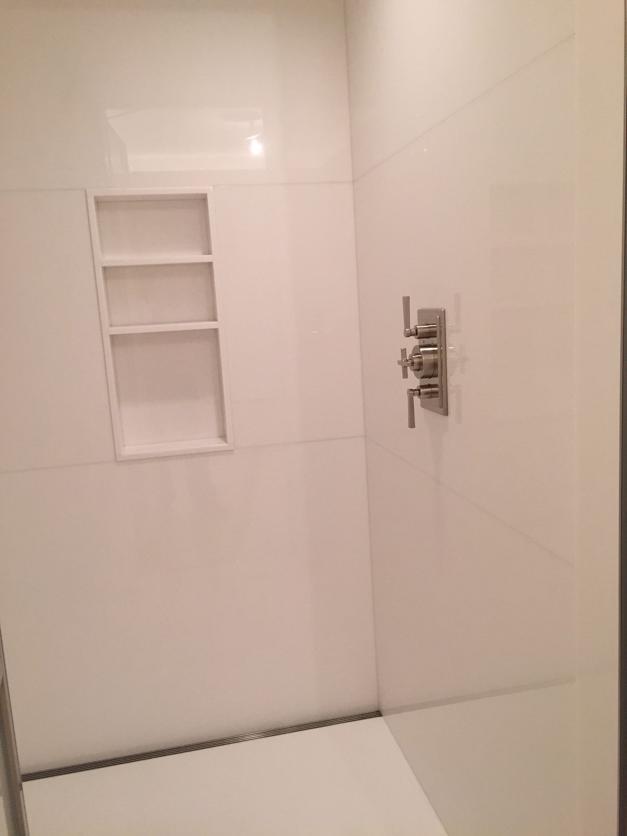 Master bathroom shower in white thassos slab